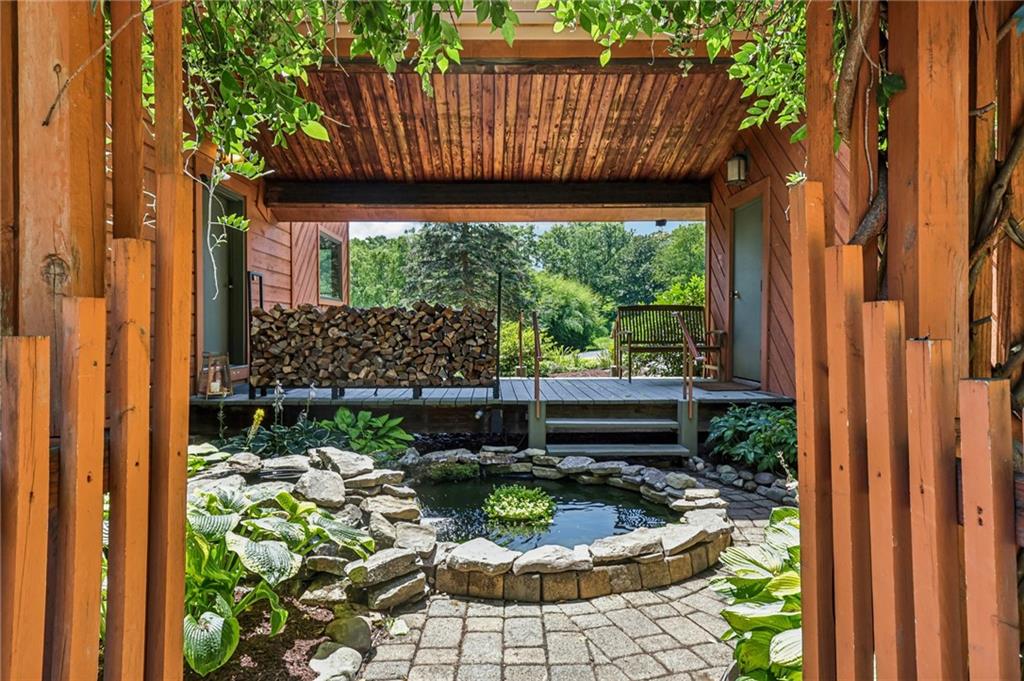 8110 Ridge Road Natrona Heights, PA 15065 - Photo 6 of 50 a view of a patio with table and chairs potted plants with wooden floor and fence