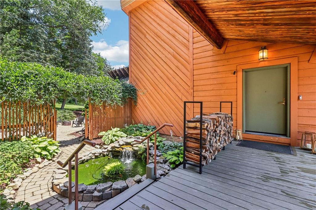 8110 Ridge Road Natrona Heights, PA 15065 - Photo 7 of 50 a view of a porch with furniture and flowers