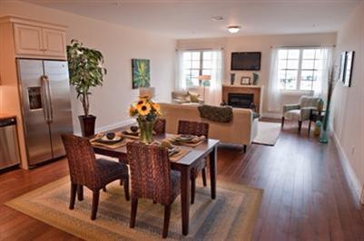 89 Lewis Bay Road, Unit 202 Hyannis, MA 02601 - Photo 3 of 5 a view of a dining room with furniture window and wooden floor
