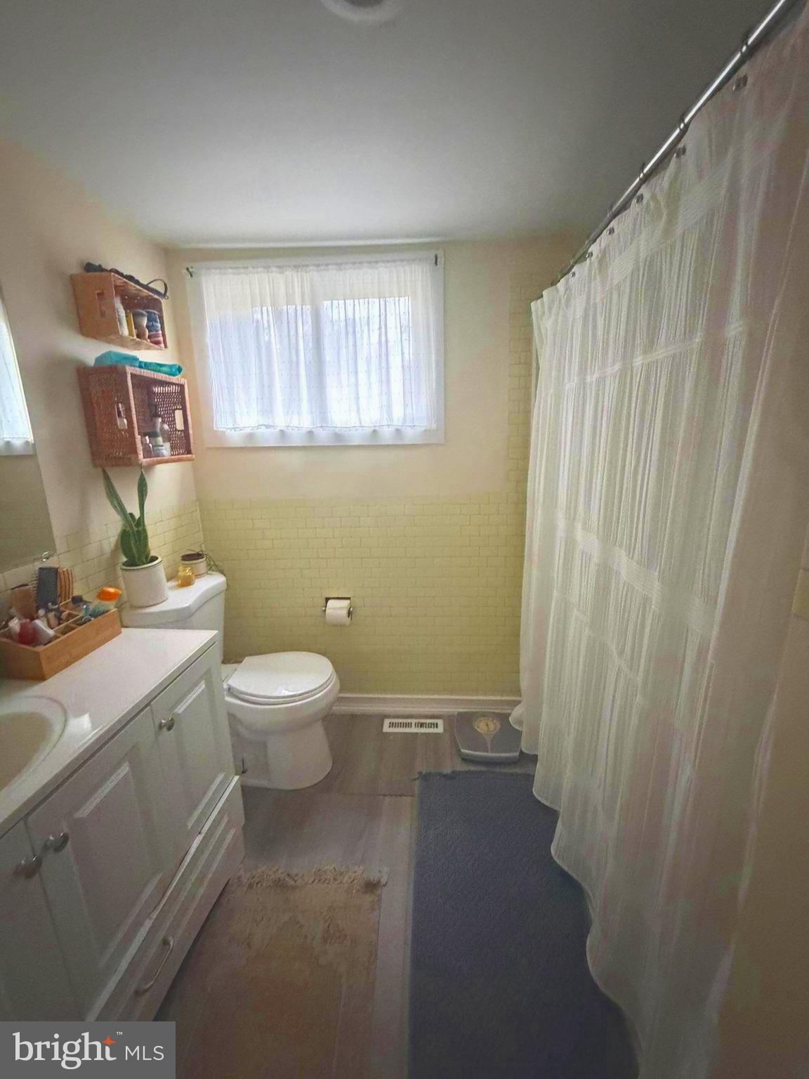 2814 3rd Street Norristown, PA 19403 - Photo 4 of 11 a bathroom with a granite countertop sink a toilet and a shower