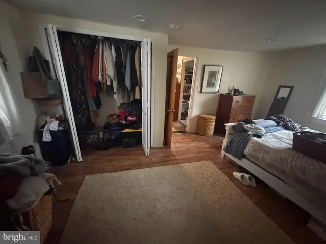 a bed room with furniture and a window