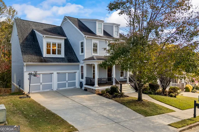a view of a house with wooden fence