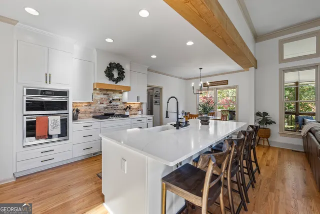 a bathroom with a double vanity sink toilet and shower