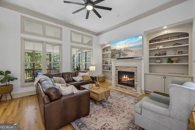 a bedroom with furniture a rug toys and a window