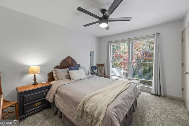 a view of walk in closet with clothes