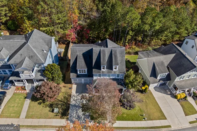 a view of a livingroom with furniture and hardwood floor