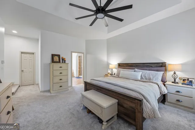 an aerial view of residential house with outdoor space and seating area