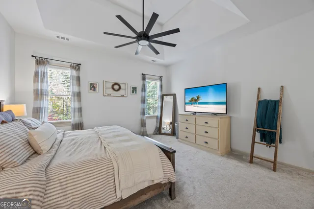 an aerial view of residential house with outdoor space and seating area