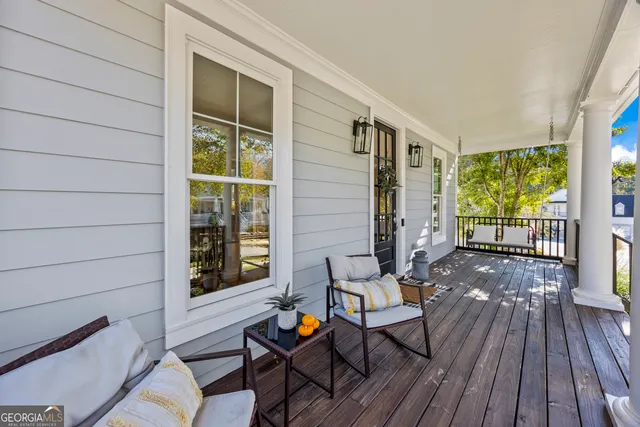 a large white kitchen with a large window