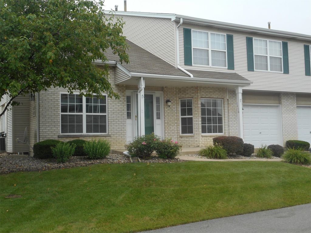 1456 Berta Drive Crest Hill, IL 60403 - Photo 1 of 17 a view of a house with a garden and plants