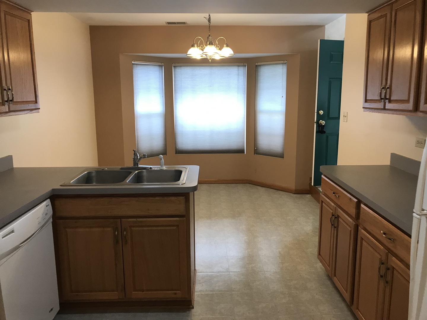 1456 Berta Drive Crest Hill, IL 60403 - Photo 7 of 17 a kitchen with a sink and a mirror