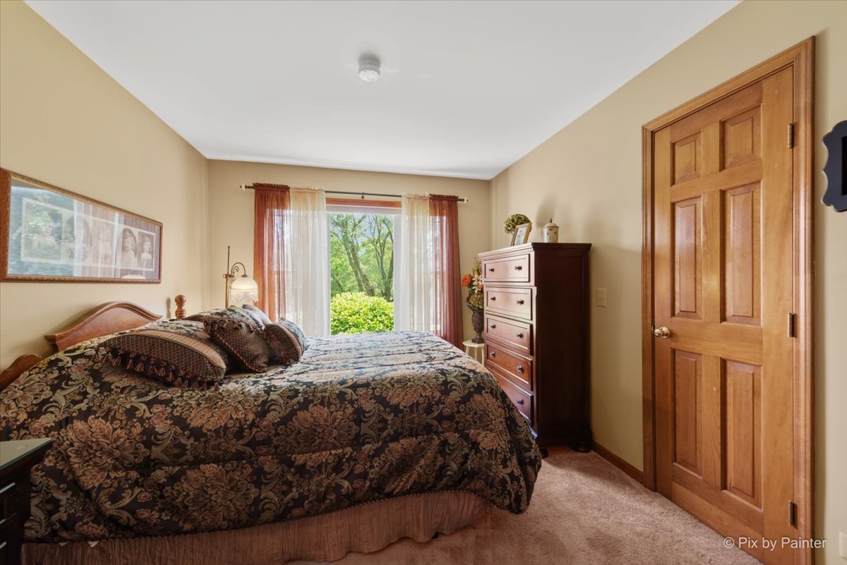 936 Ridgewood Drive Cary, IL 60013 - Photo 25 of 45 a bedroom with a bed and a dresser next to a window