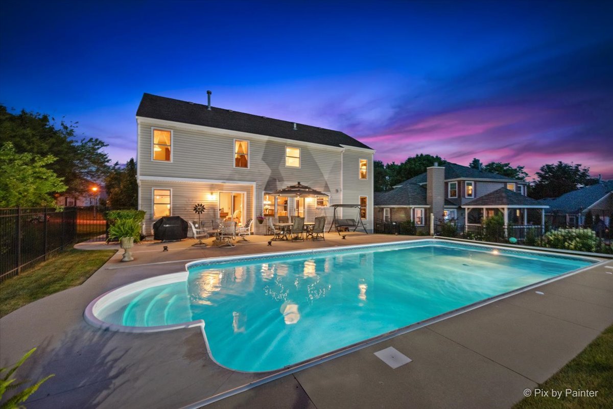 936 Ridgewood Drive Cary, IL 60013 - Photo 3 of 45 a view of a swimming pool with a patio