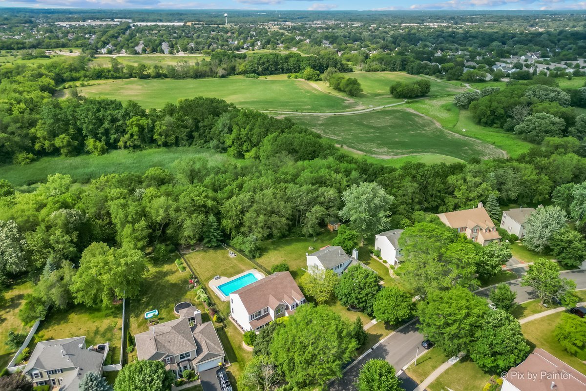 936 Ridgewood Drive Cary, IL 60013 - Photo 4 of 45 an aerial view of residential houses with outdoor space and trees