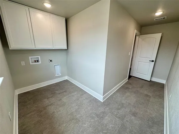 a view of an empty room and a window