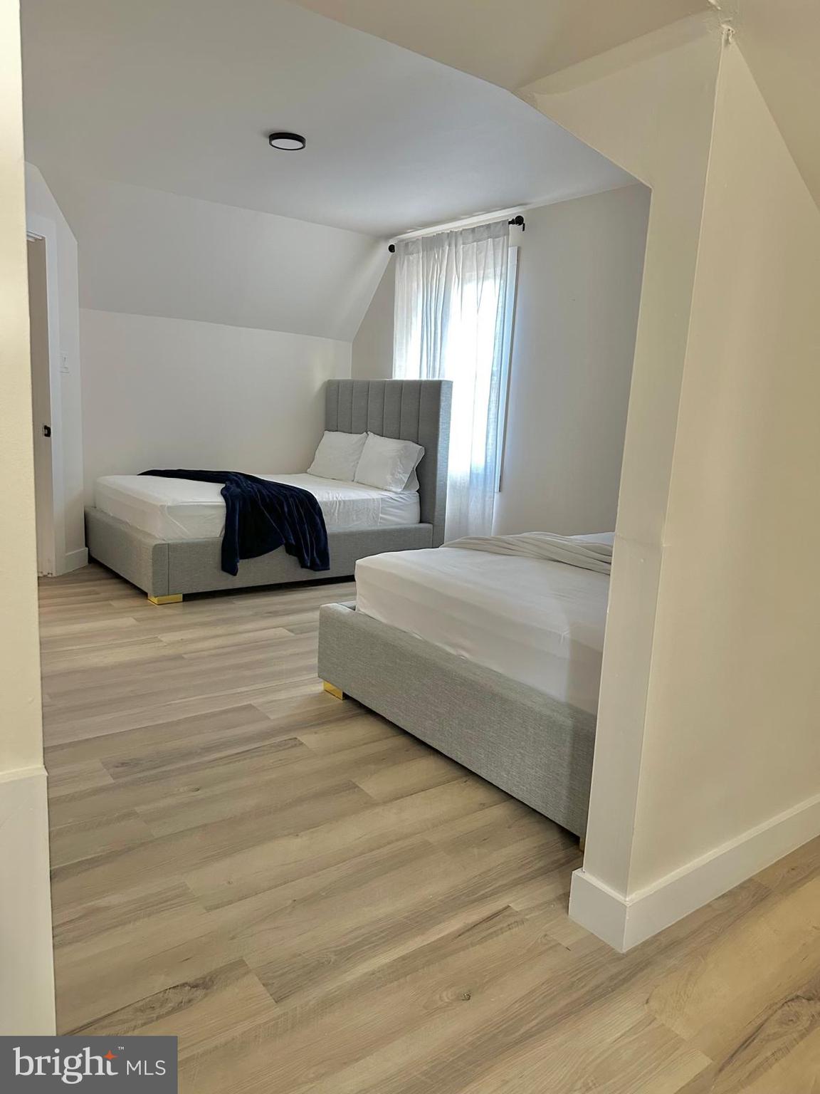 3300 Springfield Avenue Pennsauken, NJ 08109 - Photo 26 of 56 a bedroom with a bed and a night stand