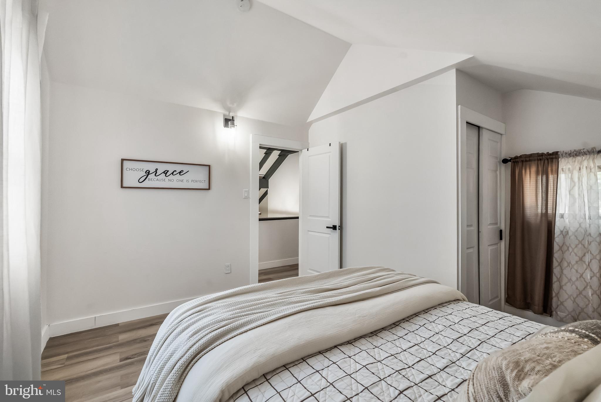 3300 Springfield Avenue Pennsauken, NJ 08109 - Photo 39 of 56 a bedroom with a large bed and a chandelier