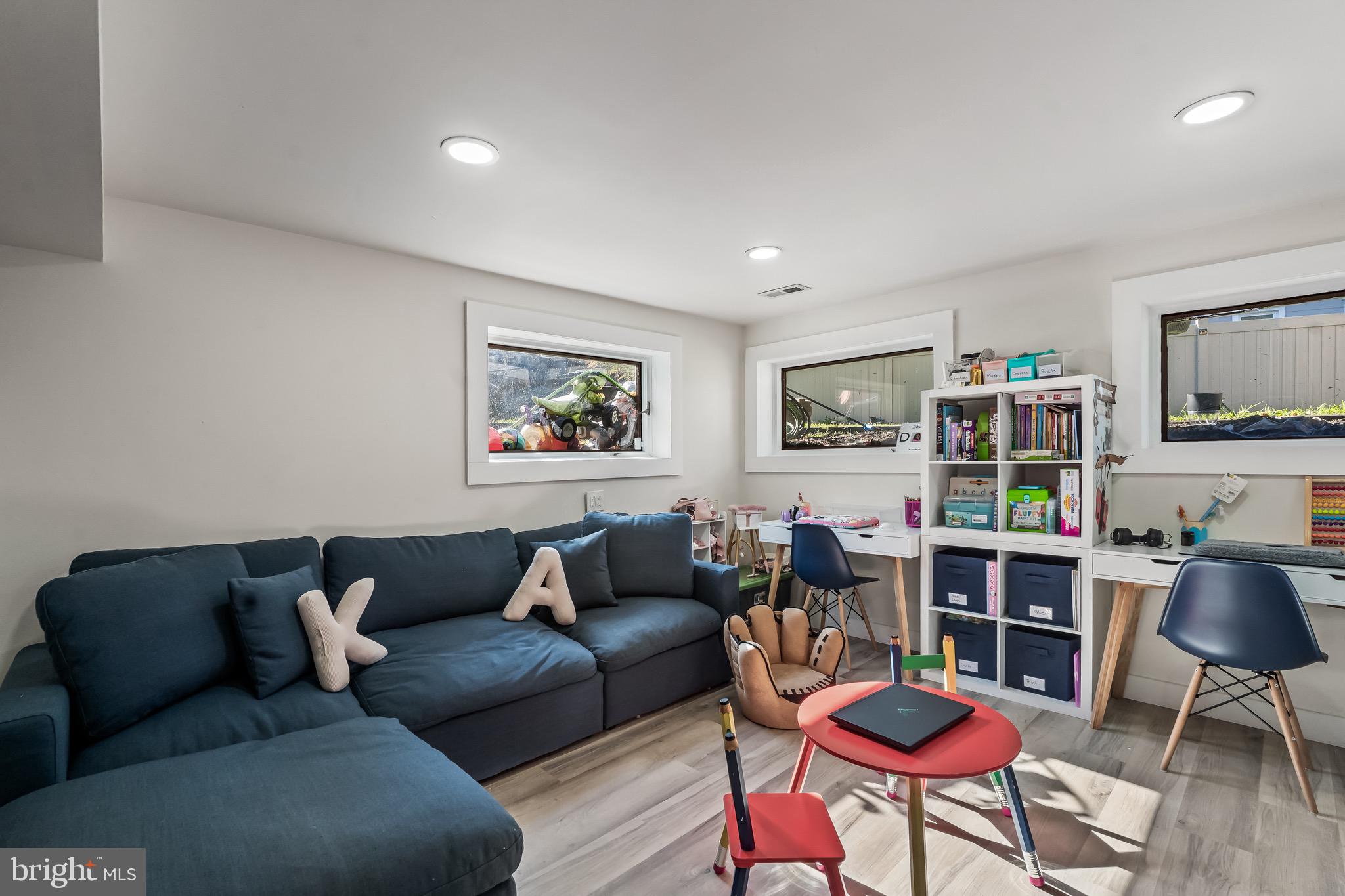 3300 Springfield Avenue Pennsauken, NJ 08109 - Photo 50 of 56 a living room with furniture a flat screen tv and a window