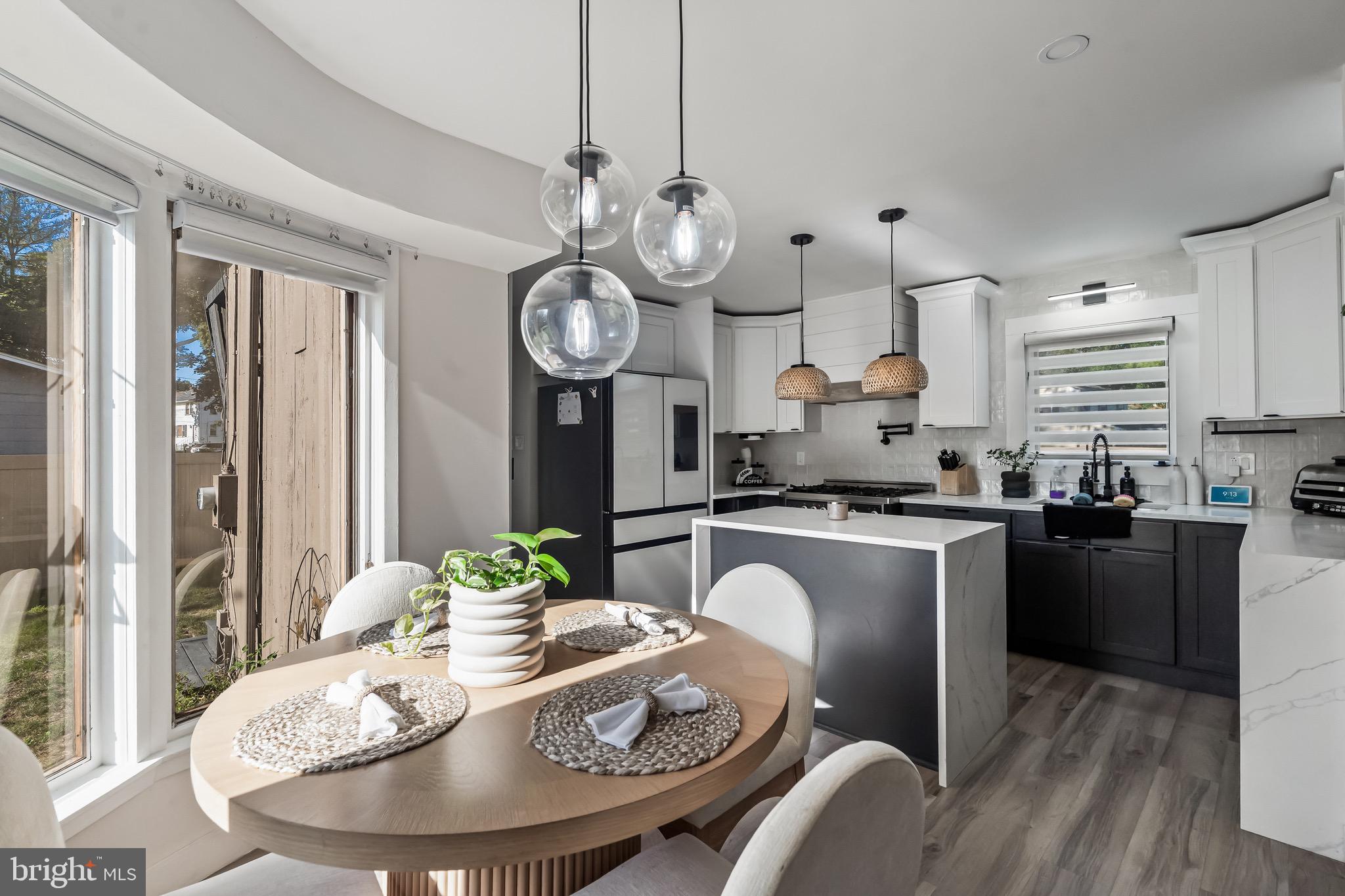 3300 Springfield Avenue Pennsauken, NJ 08109 - Photo 9 of 56 a view of a dining room with furniture a chandelier and wooden floor