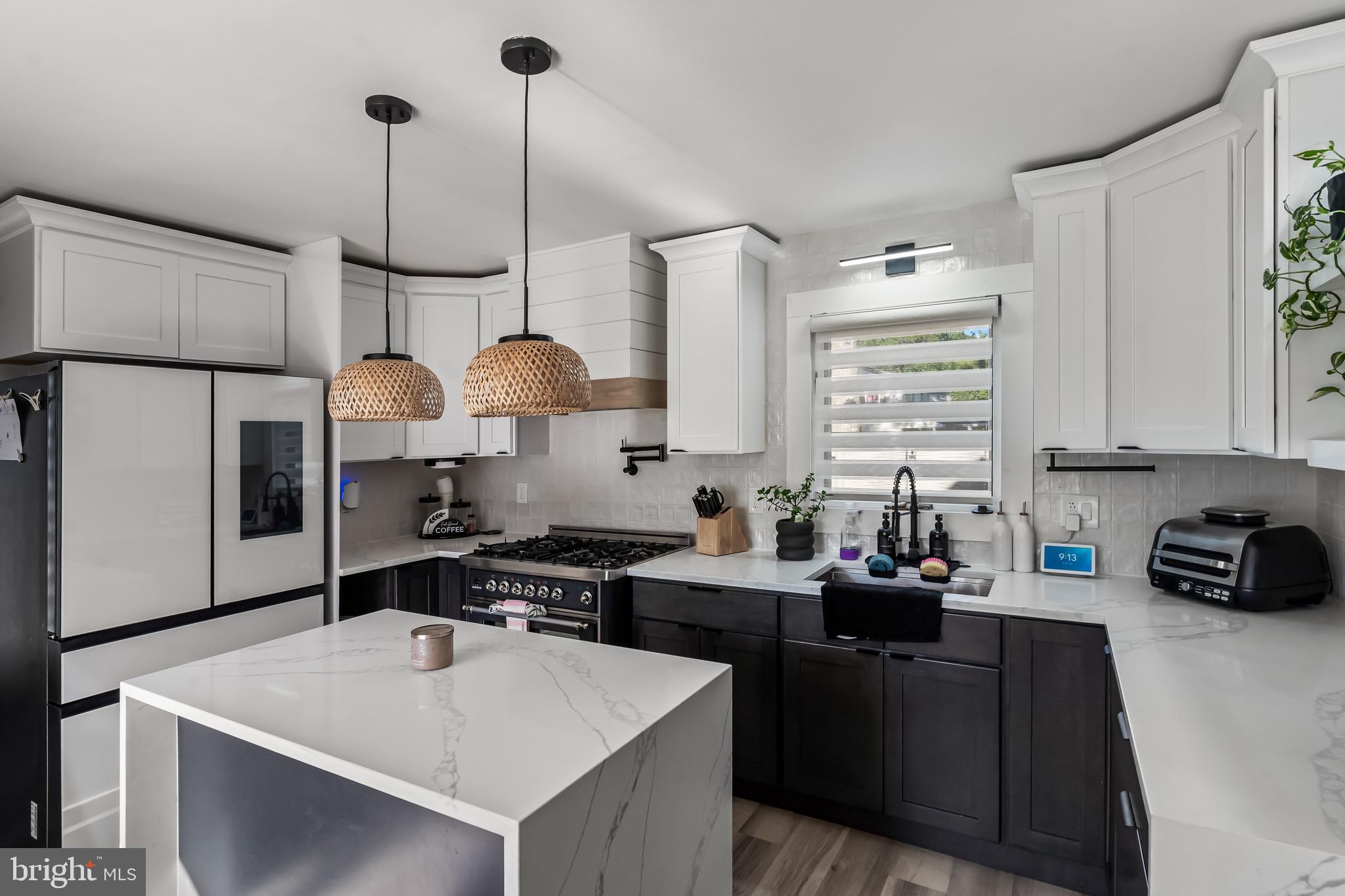3300 Springfield Avenue Pennsauken, NJ 08109 - Photo 10 of 56 a kitchen with a sink a stove a refrigerator and cabinets