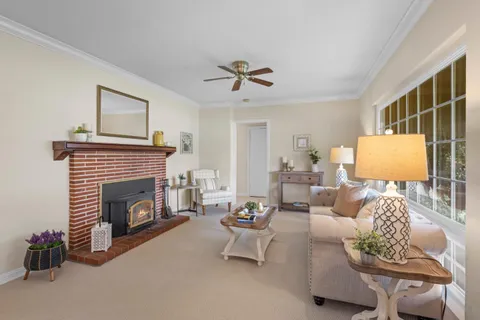 a dining room with furniture and window