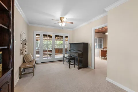 a view of a room with furniture and a chandelier
