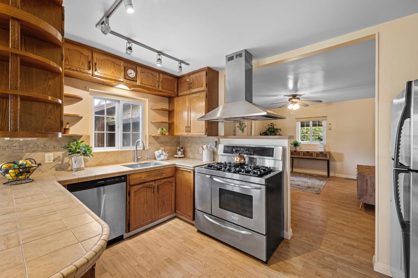 13755 Columbet Avenue San Martin, CA 95046 - Photo 24 of 61 a kitchen with stainless steel appliances a stove a sink and a refrigerator