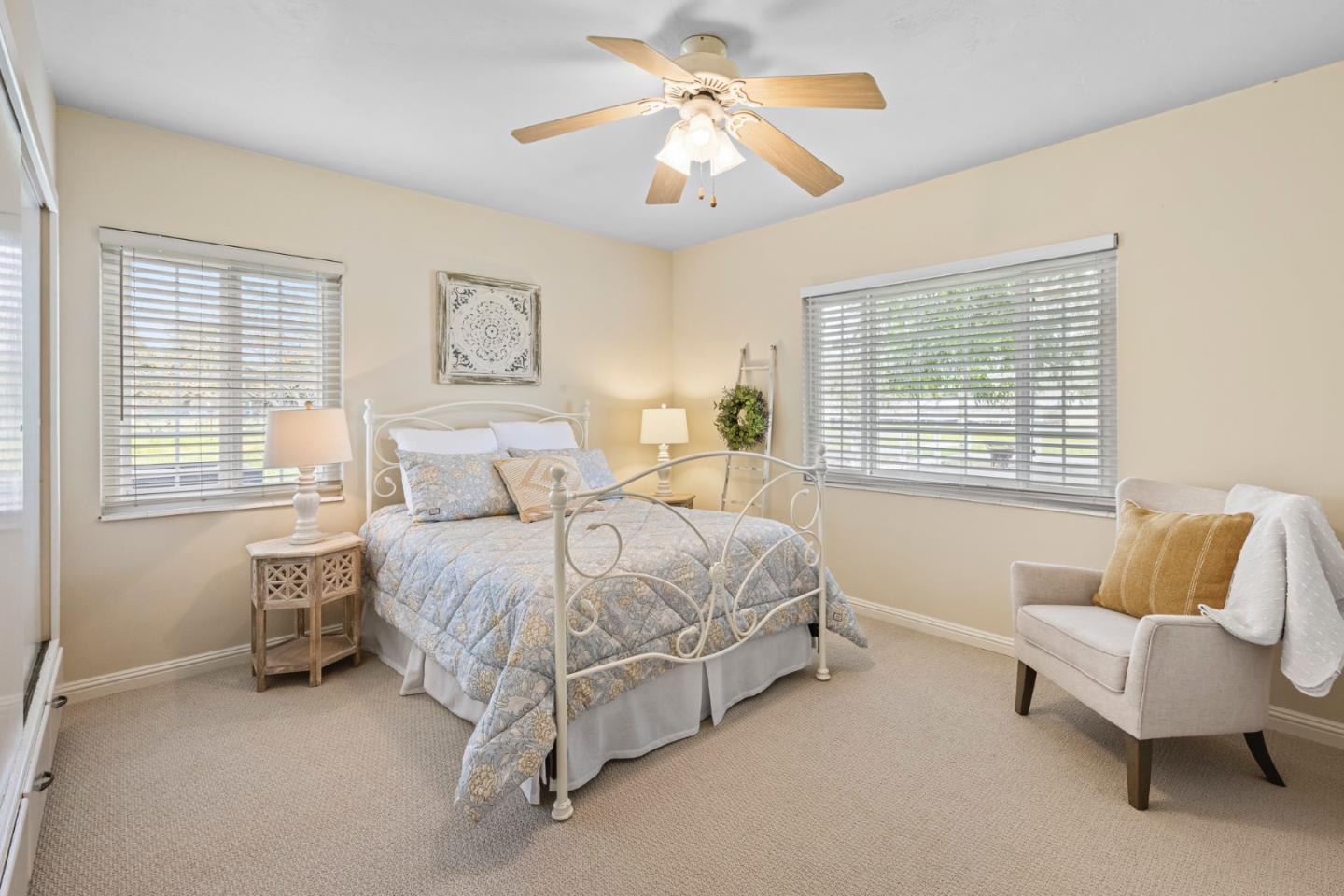 13755 Columbet Avenue San Martin, CA 95046 - Photo 28 of 61 a spacious bedroom with a bed and a couch