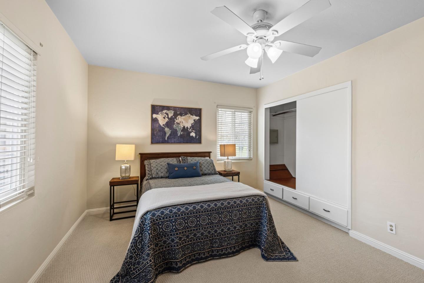 13755 Columbet Avenue San Martin, CA 95046 - Photo 29 of 61 a bedroom with a large bed and a chandelier