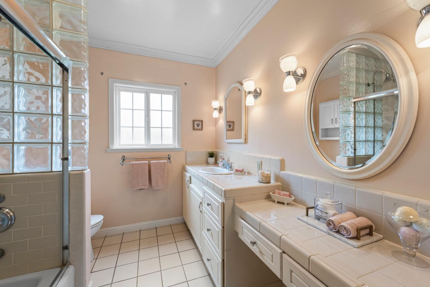 13755 Columbet Avenue San Martin, CA 95046 - Photo 30 of 61 a bathroom with a granite countertop toilet a sink and a mirror