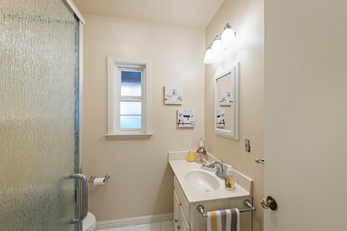 13755 Columbet Avenue San Martin, CA 95046 - Photo 32 of 61 a bathroom with a sink a toilet and shower
