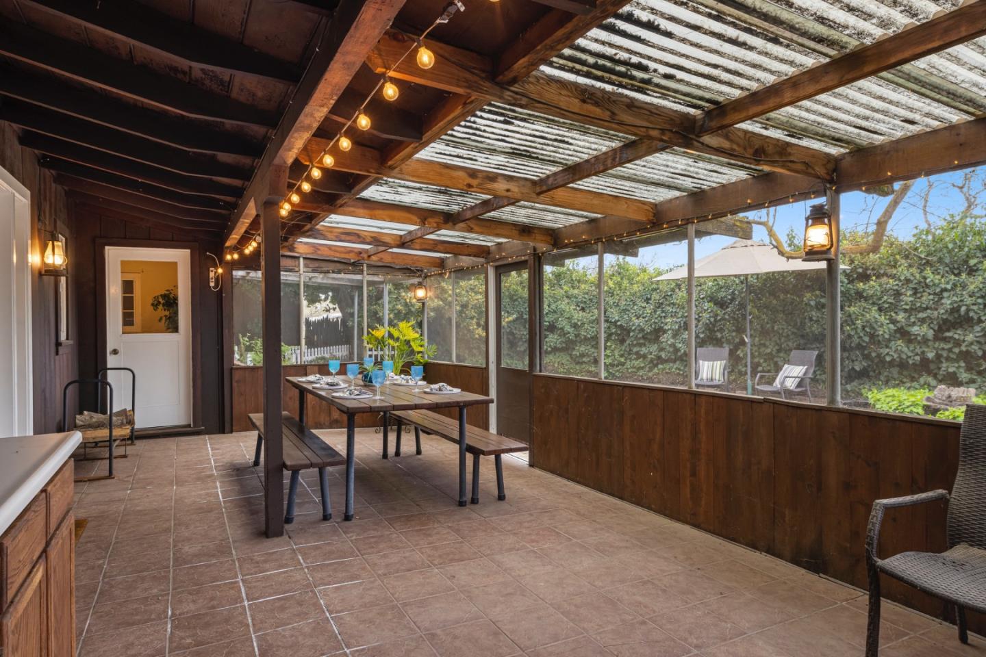 13755 Columbet Avenue San Martin, CA 95046 - Photo 36 of 61 a view of a porch with furniture and a yard
