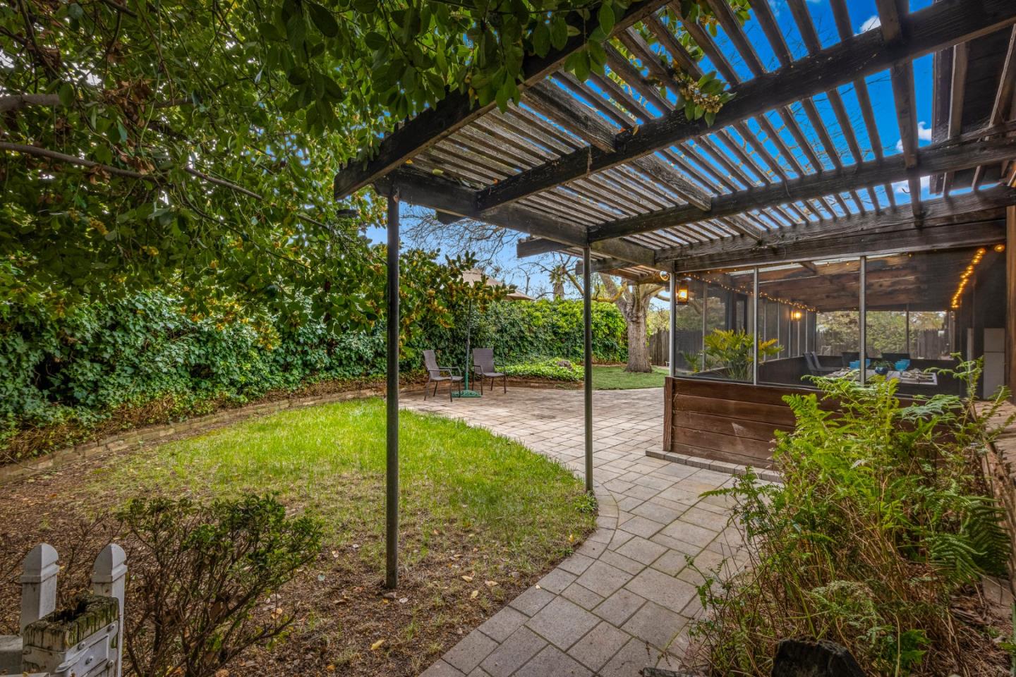 13755 Columbet Avenue San Martin, CA 95046 - Photo 49 of 61 a view of a porch with furniture and a yard