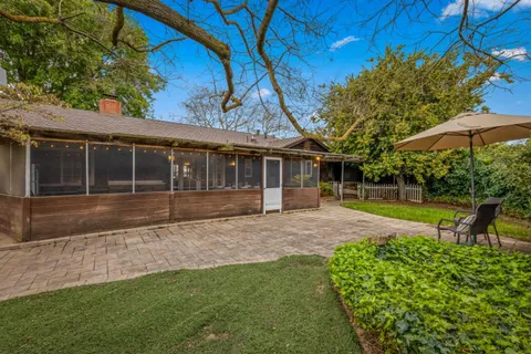 a view of a golf course with a lake view