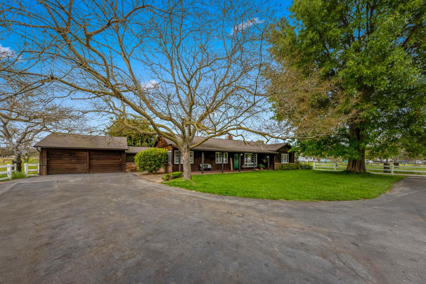 13755 Columbet Avenue San Martin, CA 95046 - Photo 53 of 61 a view of a house with a yard and large trees