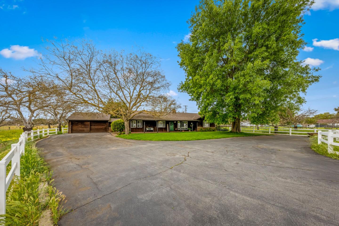 13755 Columbet Avenue San Martin, CA 95046 - Photo 57 of 61 a view of a house with a yard and large trees