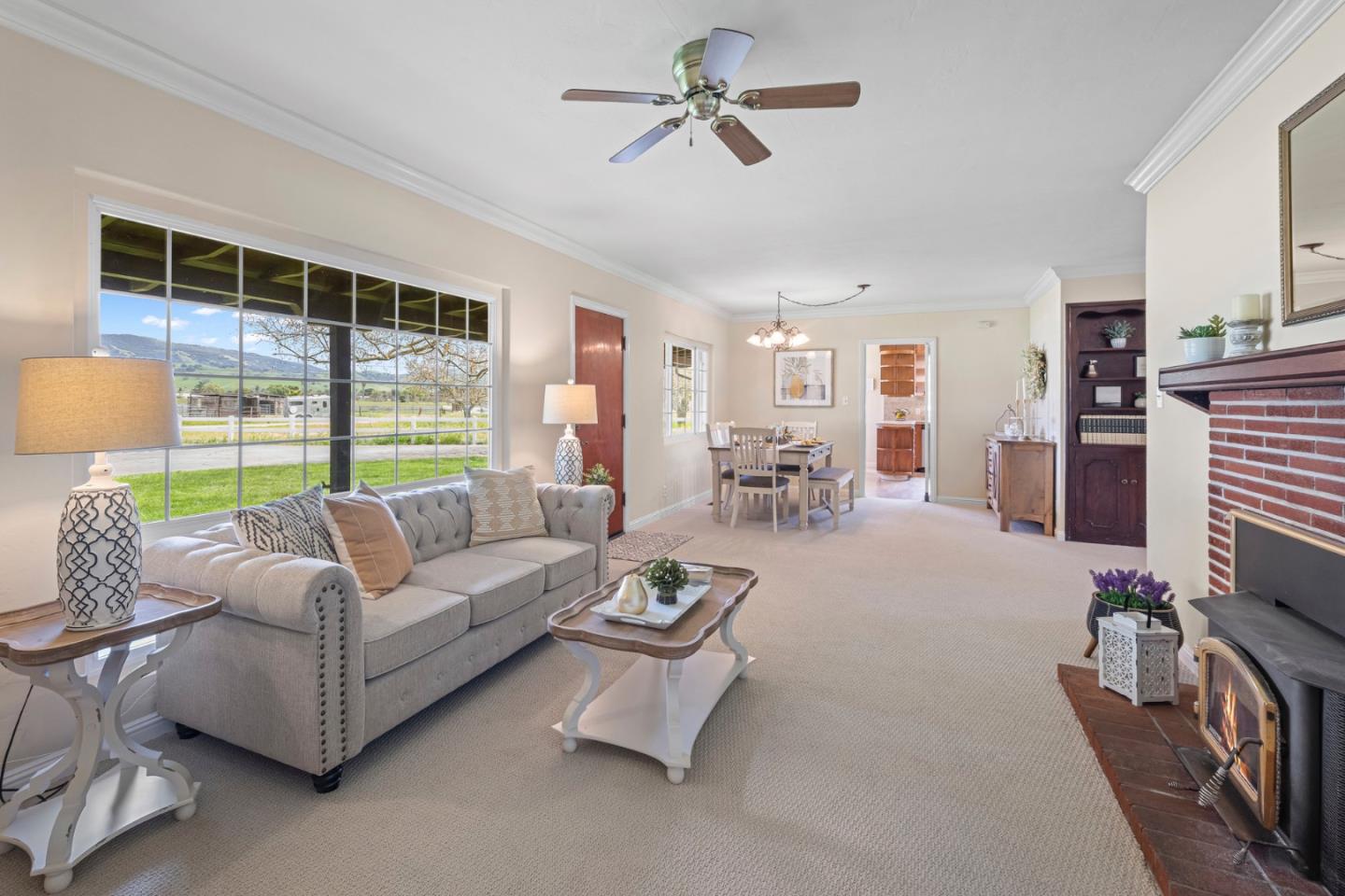 13755 Columbet Avenue San Martin, CA 95046 - Photo 6 of 61 a living room with furniture a ceiling fan and a window