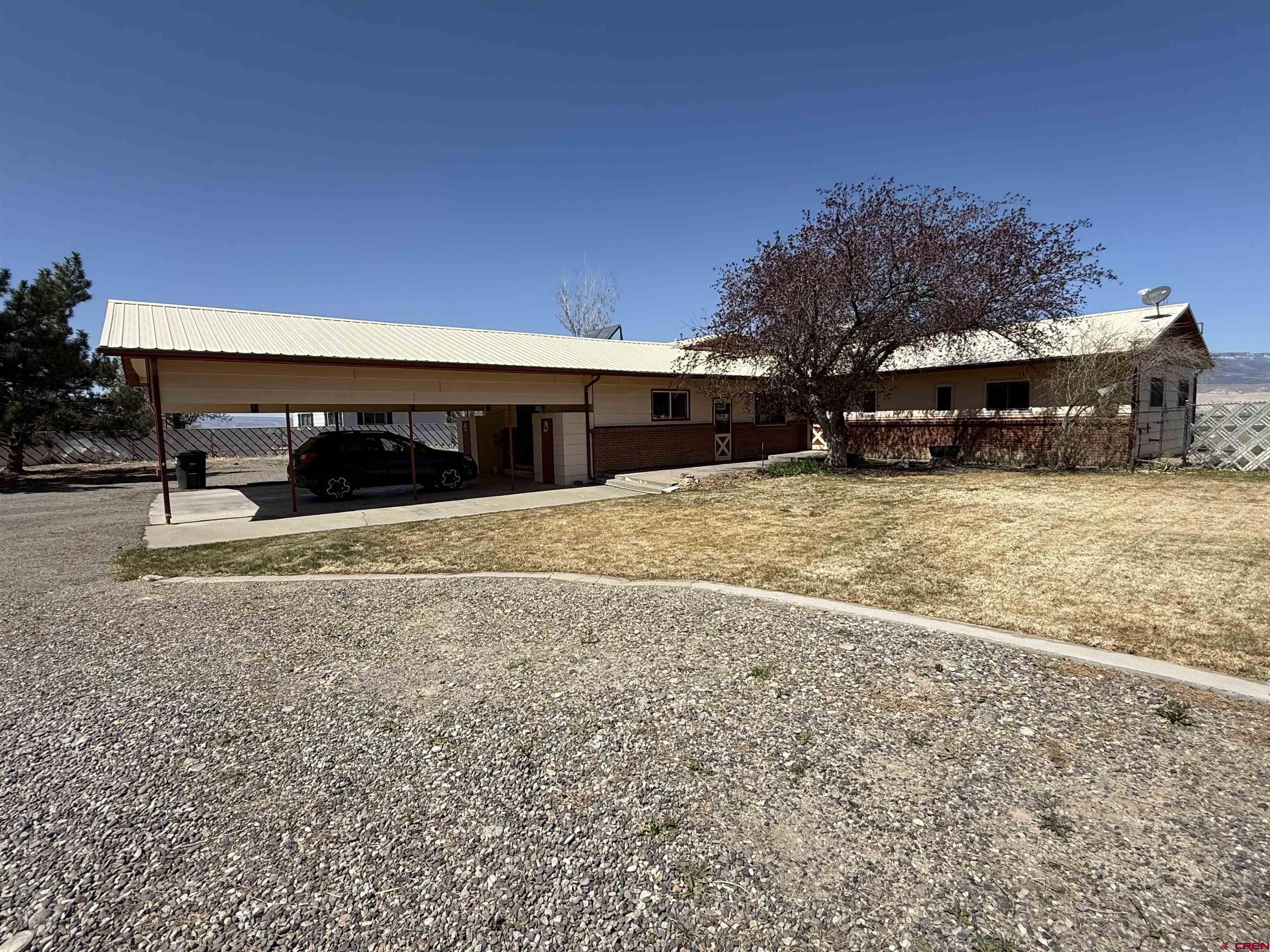 1793 Roundup Road Delta, CO 81416 - Photo 1 of 41 a view of a house with a yard