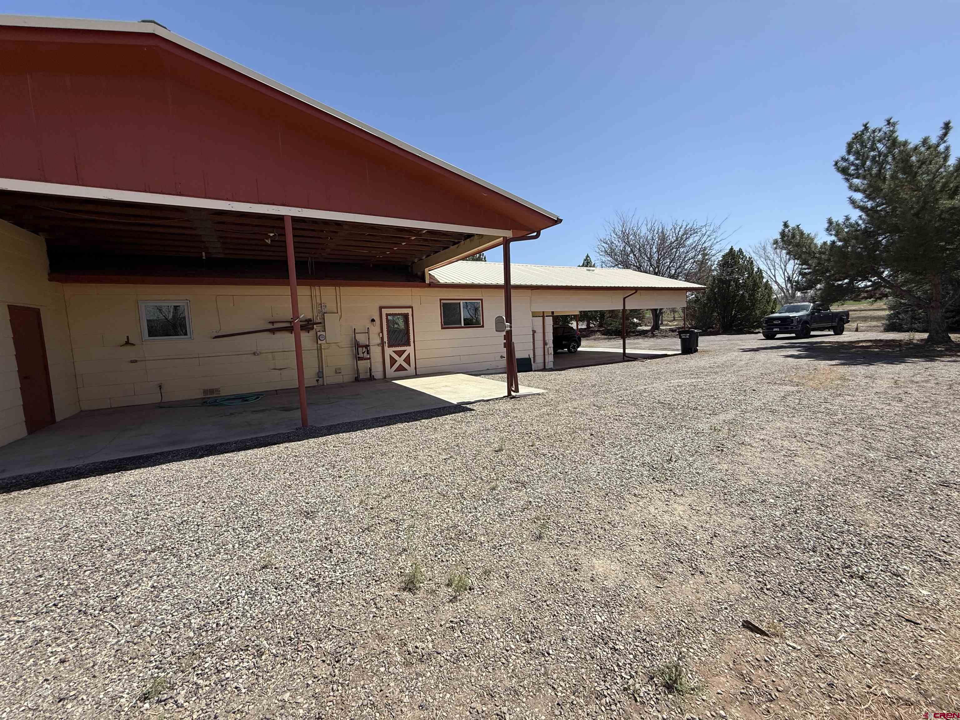 1793 Roundup Road Delta, CO 81416 - Photo 13 of 41 a view of a house with backyard and sitting area