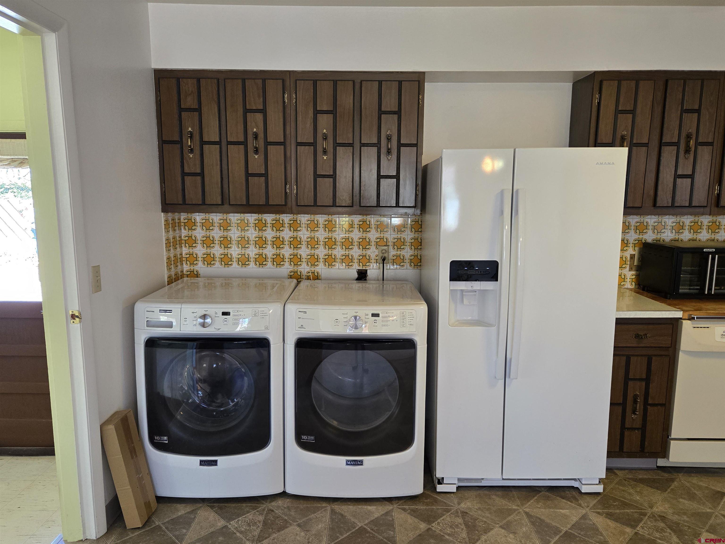 1793 Roundup Road Delta, CO 81416 - Photo 21 of 41 a utility room with dryer and washer