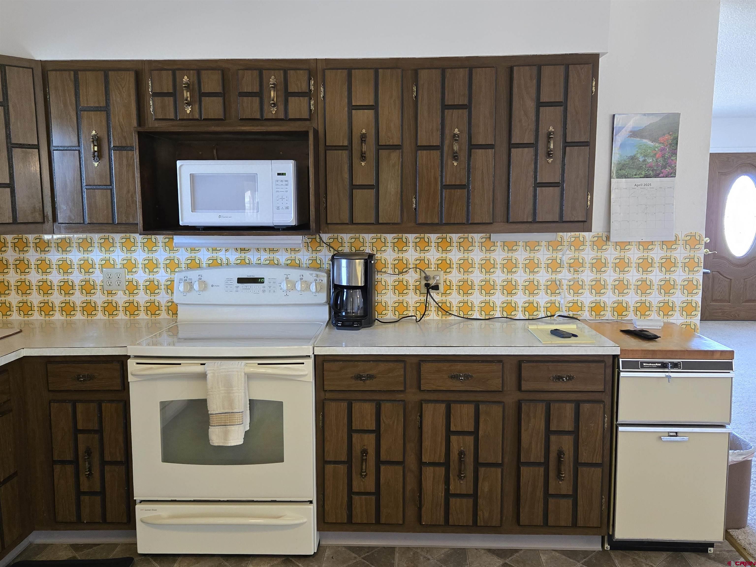 1793 Roundup Road Delta, CO 81416 - Photo 23 of 41 a kitchen with a sink and cabinets