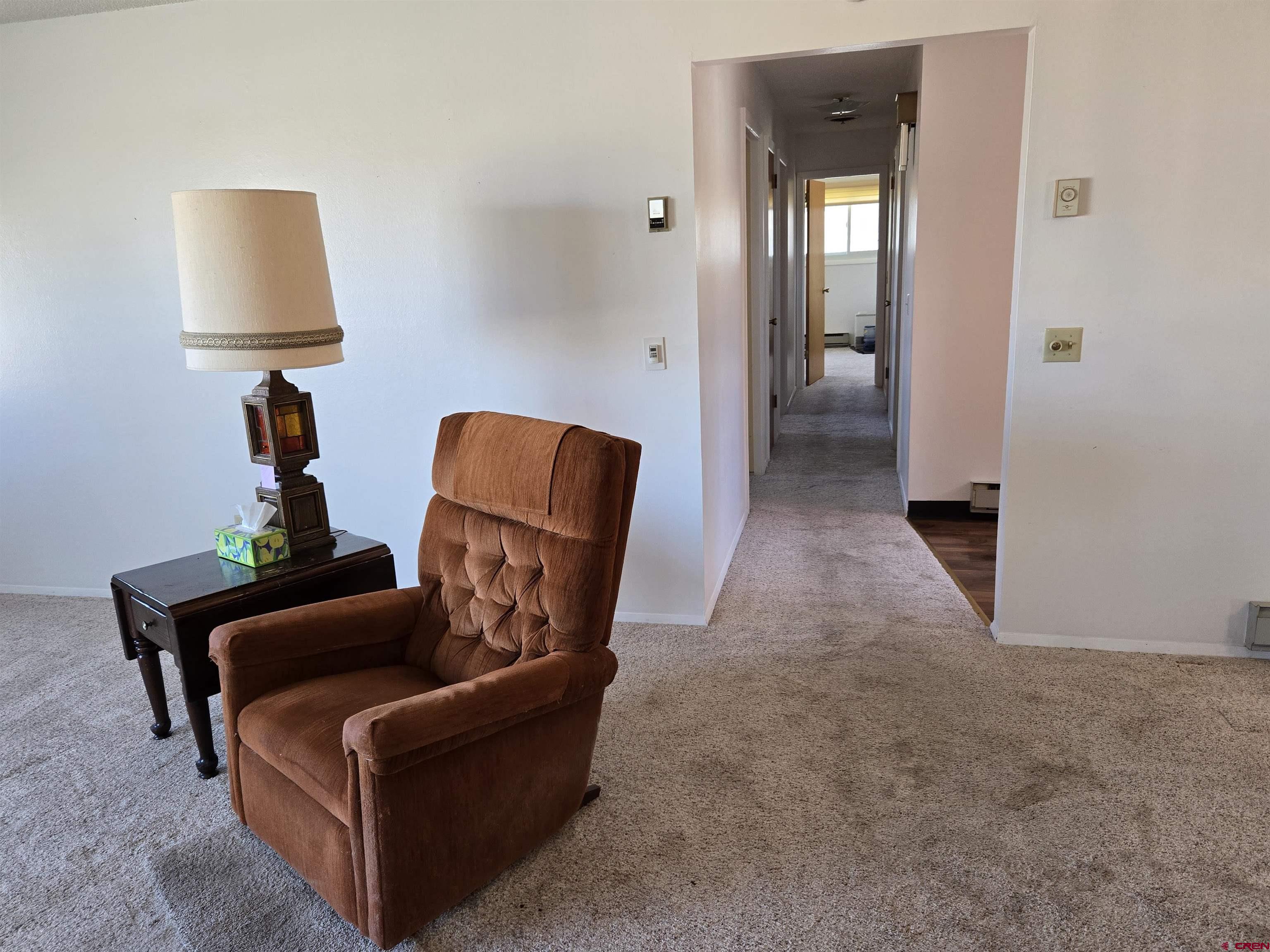 1793 Roundup Road Delta, CO 81416 - Photo 29 of 41 a living room with furniture and a lamp