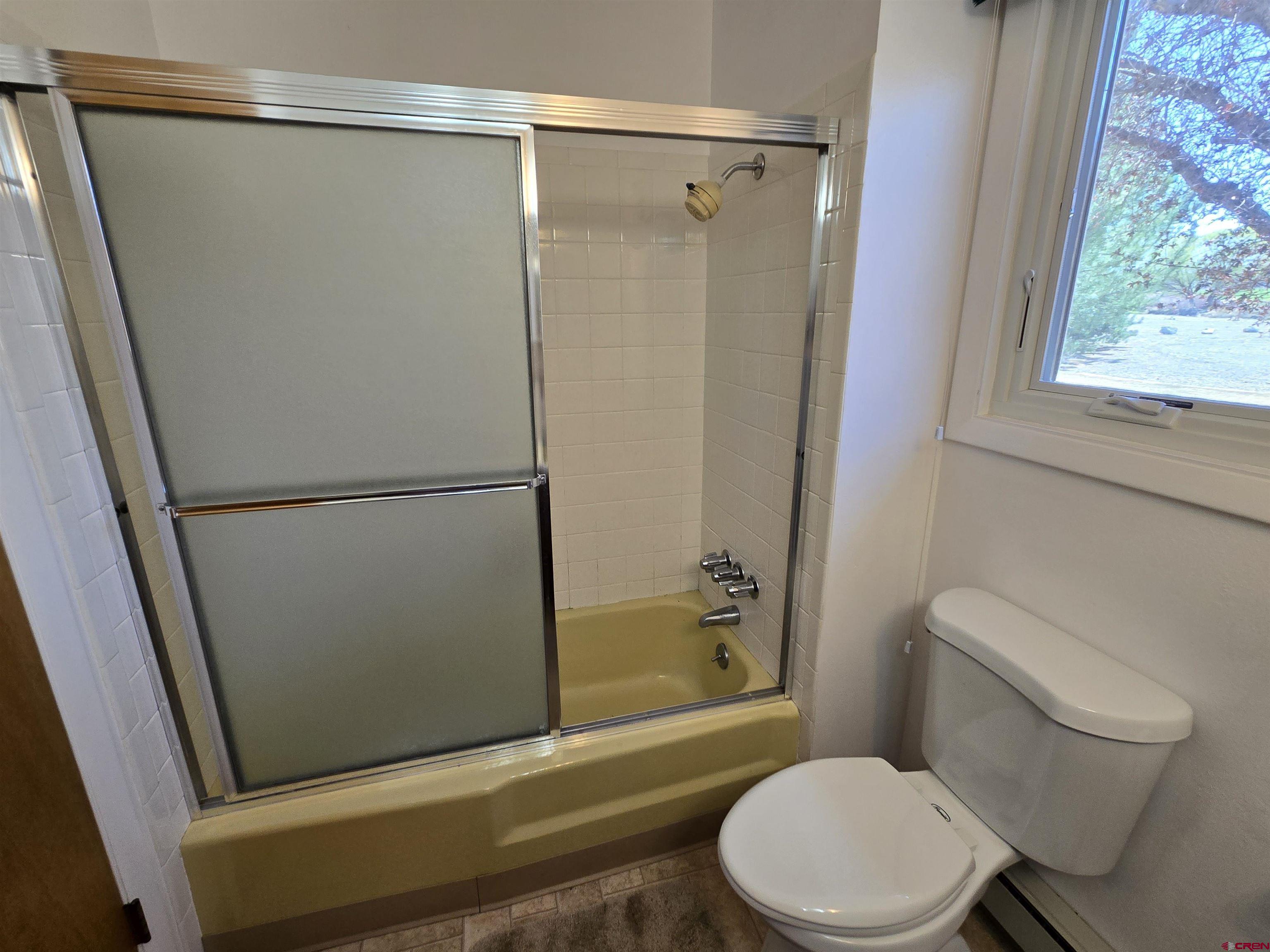 1793 Roundup Road Delta, CO 81416 - Photo 35 of 41 a bathroom with a toilet and a shower