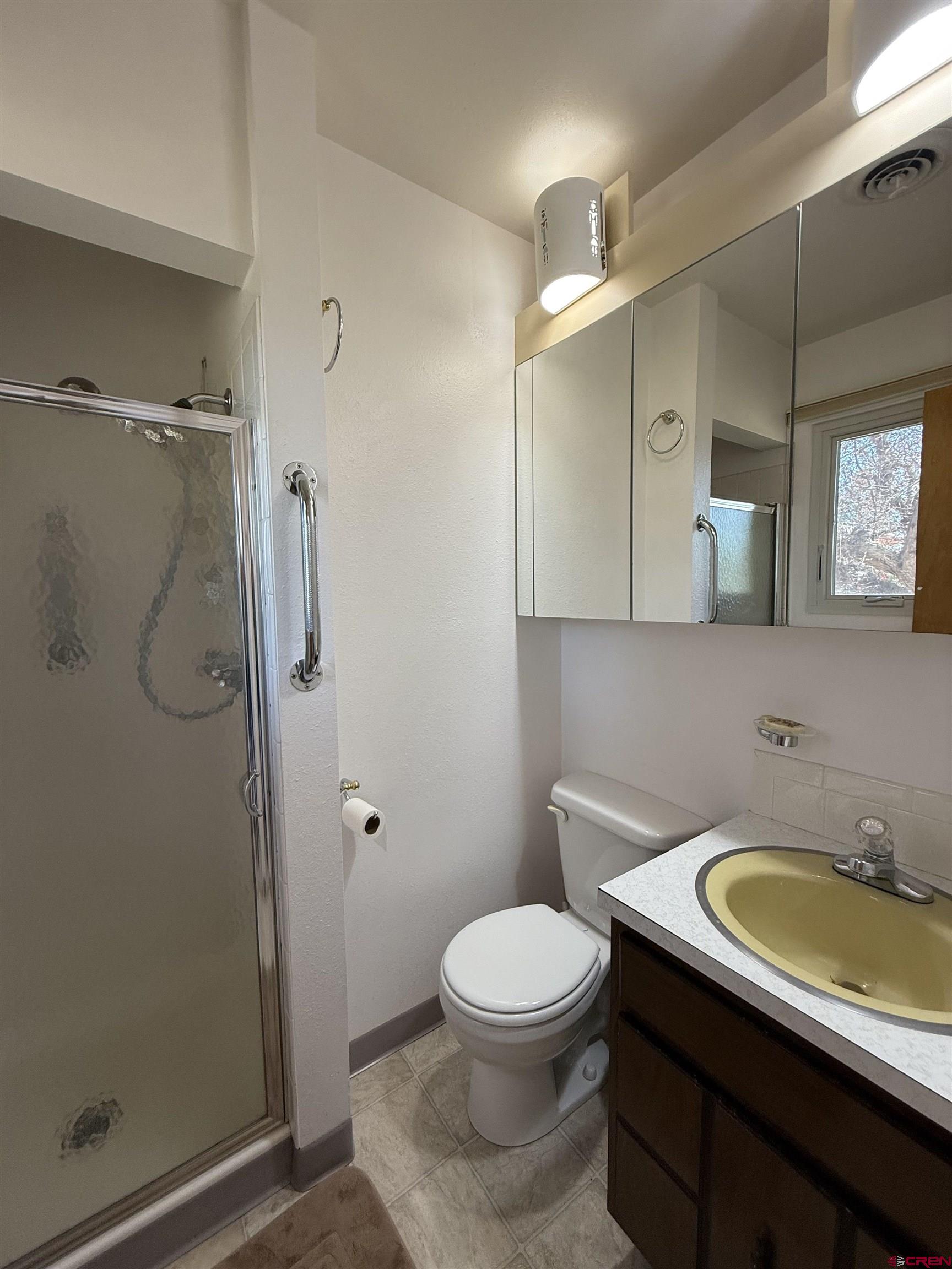 1793 Roundup Road Delta, CO 81416 - Photo 38 of 41 a bathroom with a sink toilet and shower
