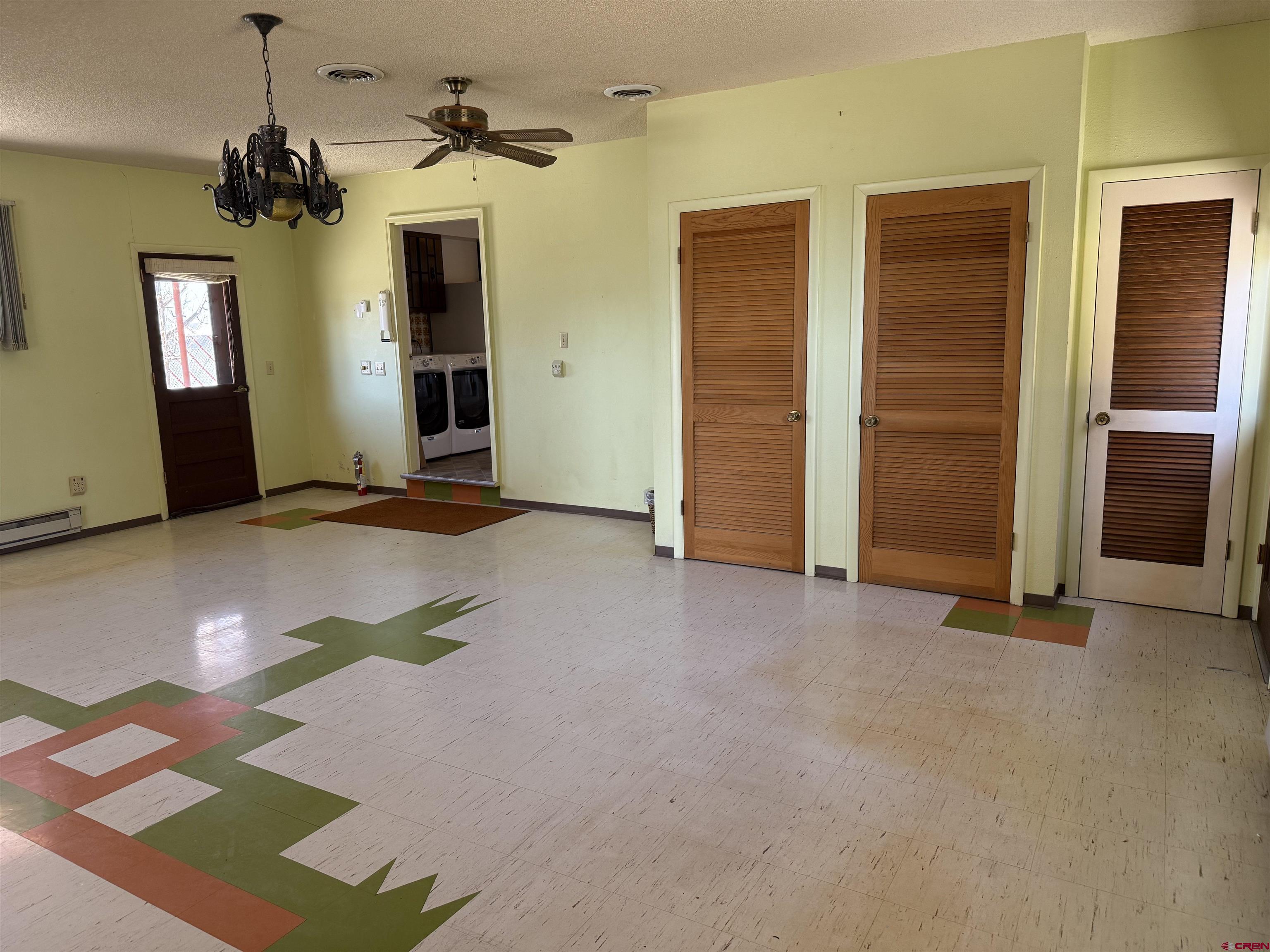 1793 Roundup Road Delta, CO 81416 - Photo 40 of 41 an empty room with closet and a chandelier fan