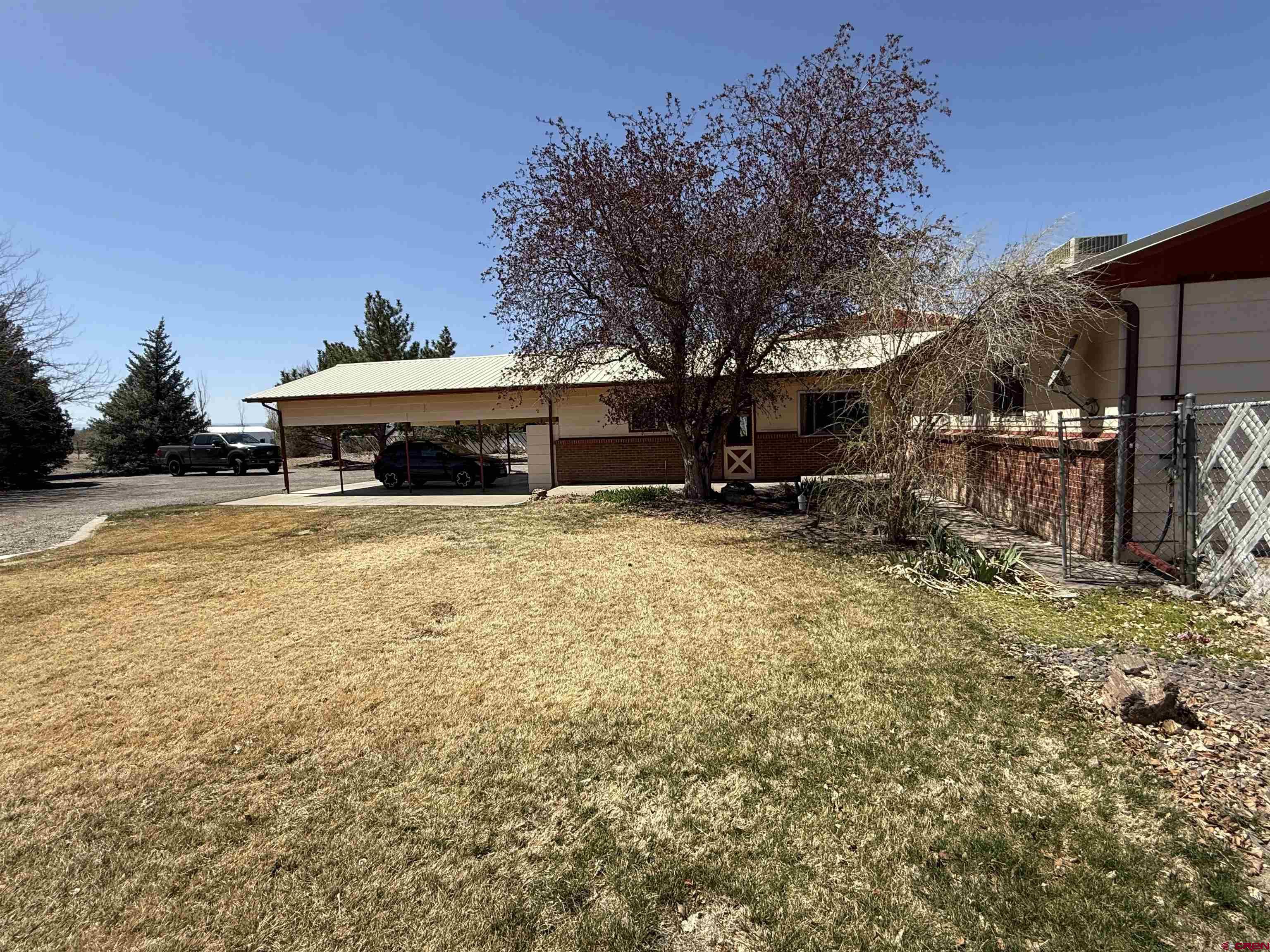 1793 Roundup Road Delta, CO 81416 - Photo 5 of 41 a view of a house with a yard and sitting area