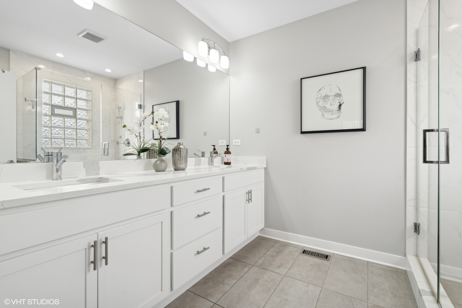 1449 East 65th Place, Unit 1 Chicago, IL 60637 - Photo 11 of 18 a bathroom with a double vanity sink and a mirror