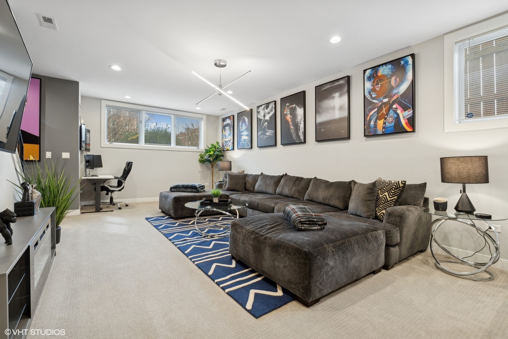 1449 East 65th Place, Unit 1 Chicago, IL 60637 - Photo 14 of 18 a living room with furniture a flat screen tv and a large window