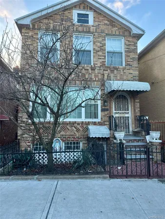 a front view of a house with parking area