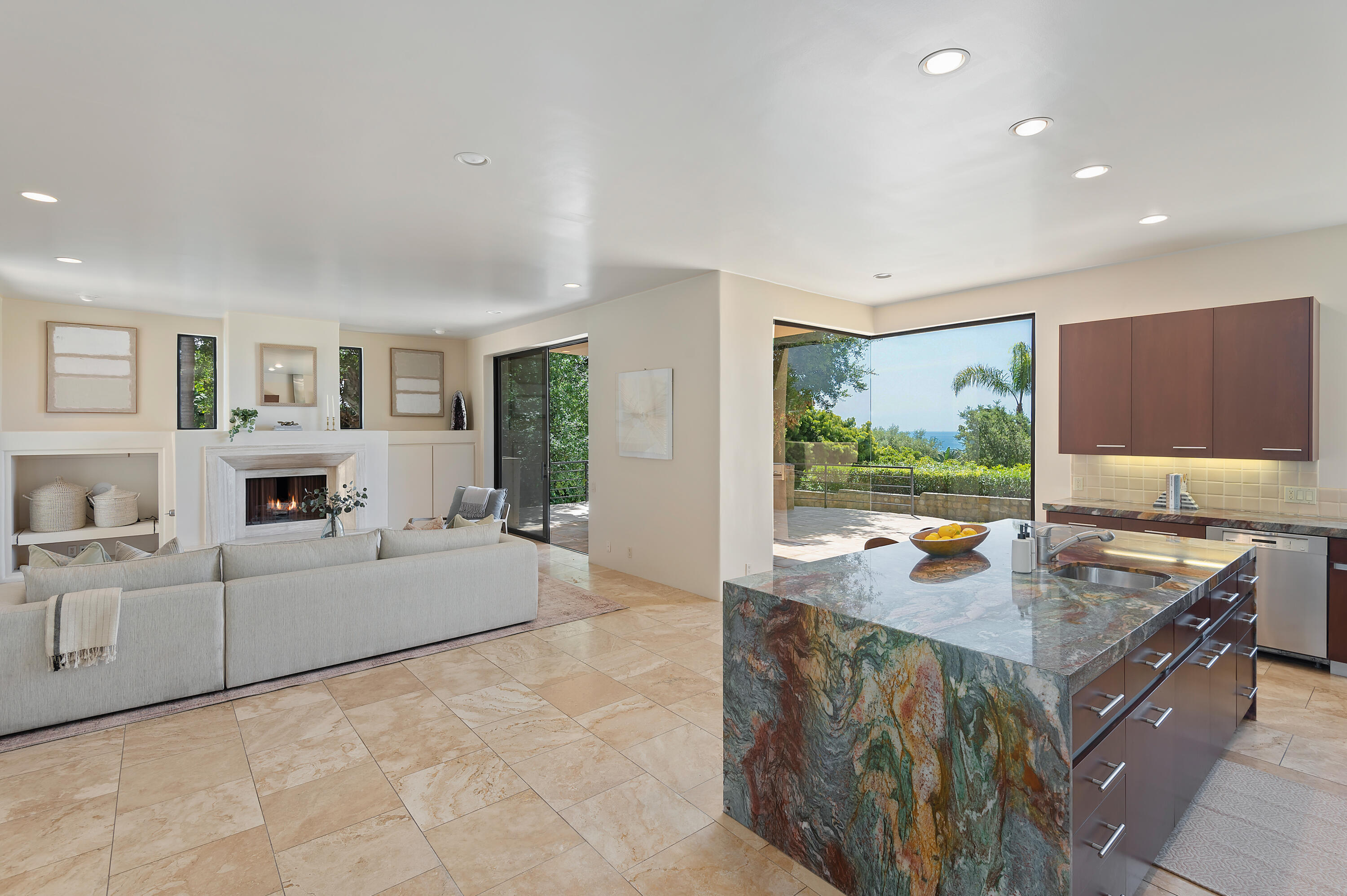 1181 Glenview Road Santa Barbara, CA 93108 - Photo 12 of 46 a living room with furniture a large window and a fireplace